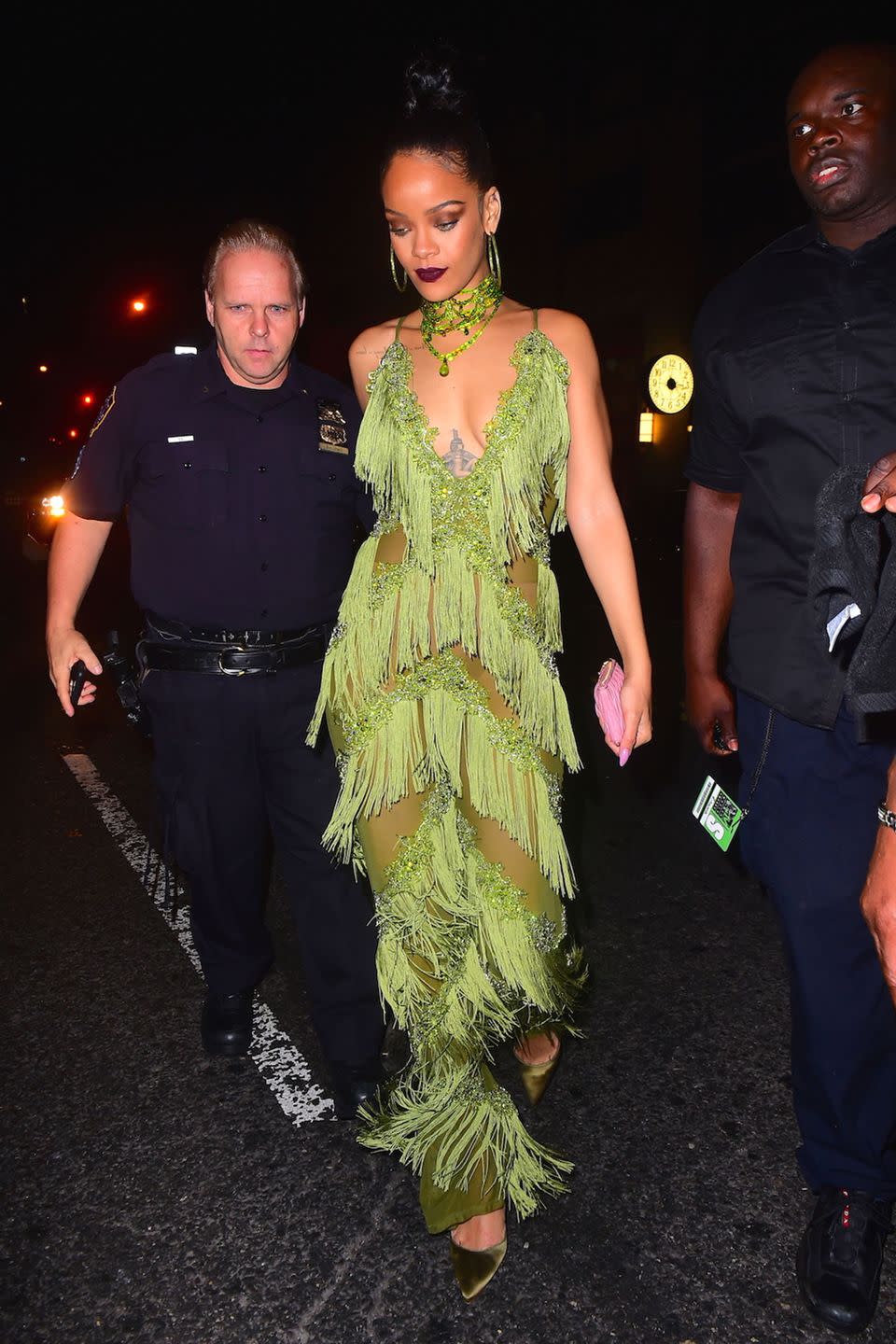 <p>Fresh off her Vanguard Award win, four performances and <a href="https://www.harpersbazaar.com/fashion/trends/a17382/rihanna-outfits-mtv-vmas-2016/" rel="nofollow noopener" target="_blank" data-ylk="slk:quadruple costume changes;elm:context_link;itc:0;sec:content-canvas" class="link ">quadruple costume changes</a> at the VMAs, Rihanna stepped out to party in a fringed green jumpsuit and matching accessories in the lime hue, from her hoop earrings and choker necklace to the velvety pumps on her feet.</p>