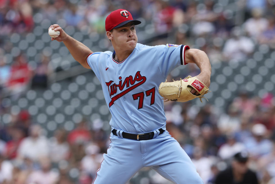 Minnesota Twins starting pitcher Cole Sands (77) throws during the first inning of a baseball game against the Tampa Bay Rays, Sunday, June 12, 2022, in Minneapolis. (AP Photo/Stacy Bengs)