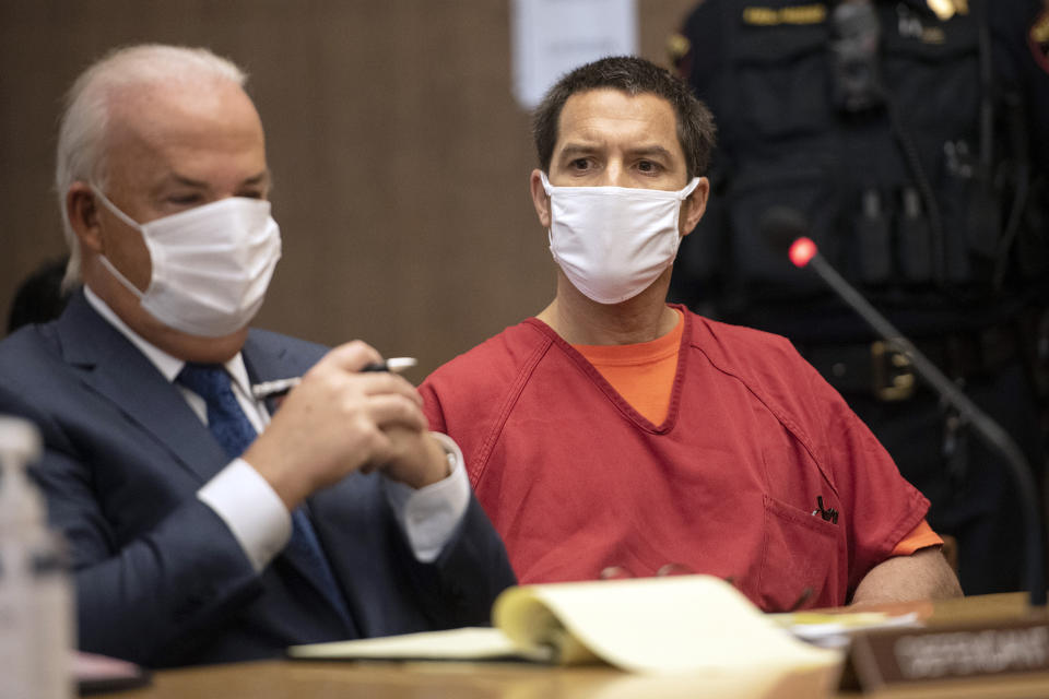 FILE - Scott Peterson listens to Stanislaus County Deputy District attorney Dave Harris speak during a hearing at the San Mateo County Superior Court in Redwood City, Calif., Wednesday, Dec. 8, 2021. Richelle Nice, a former juror who helped convict Peterson and send him to death row, is expected to testify under a grant of immunity as she kicks off a weeklong hearing starting Friday, Feb. 25, 2022 centered on whether she lied about her history with domestic violence.(Andy Alfaro/The Modesto Bee via AP, Pool, File)