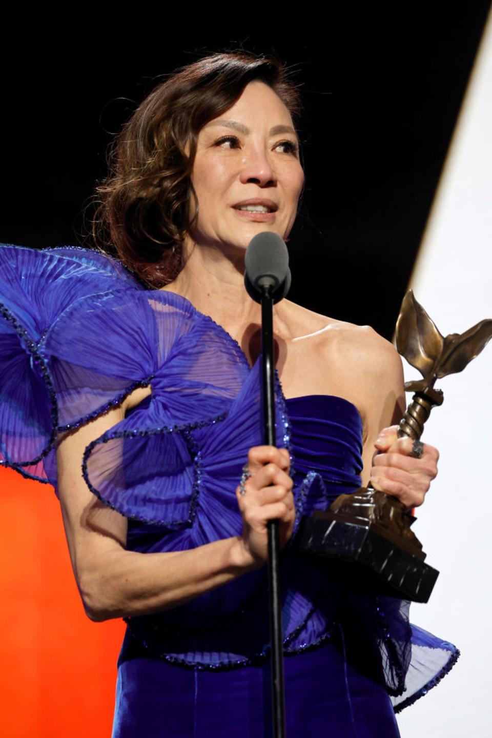 Yeoh collects her Best Actress trophy at the Independent Spirit Awards last weekend (Getty)