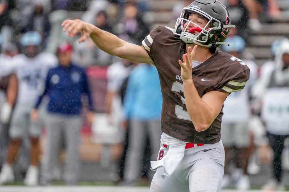 Brown quarterback Jake Willcox gets off a pass during Saturday's game against URI. Willcox was 31-for-55 for 272 yards but he had two interceptions, both by Syeed Gibbs.