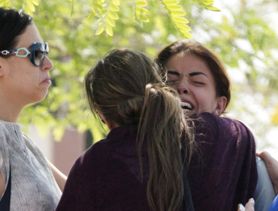 Relatives of passengers on a vanished EgyptAir flight grieve as they leave the in-flight service building where they were held at Cairo International Airport, Egypt. (AP Photo/Amr Nabil)