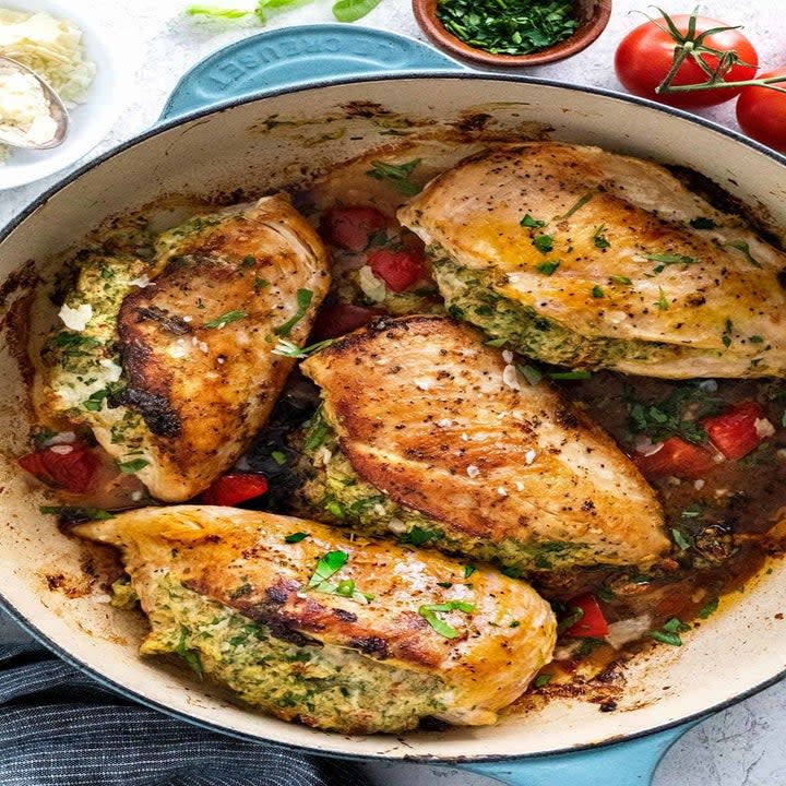 Stuffed chicken breasts in a Dutch oven.