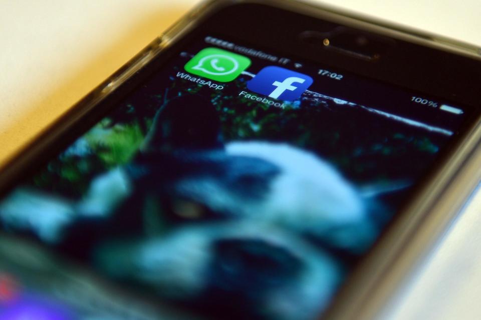 The Facebook and WhatsApp applications' icons are displayed on a smartphone on February 20, 2014 in Rome: AFP