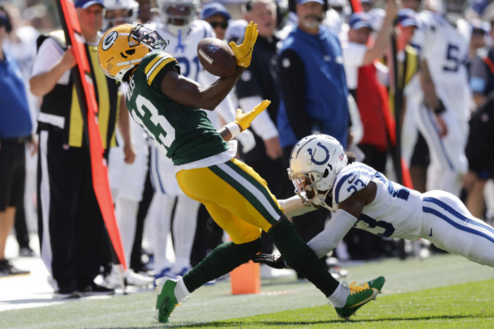 Indianapolis Colts cornerback Kenny Moore II (23) breaks up a pass intended for Green Bay Packers wide receiver Dontayvion Wicks (13) during the first half of an NFL football game Sunday, Sept. 15, 2024, in Green Bay, Wis. (AP Photo/Matt Ludtke)