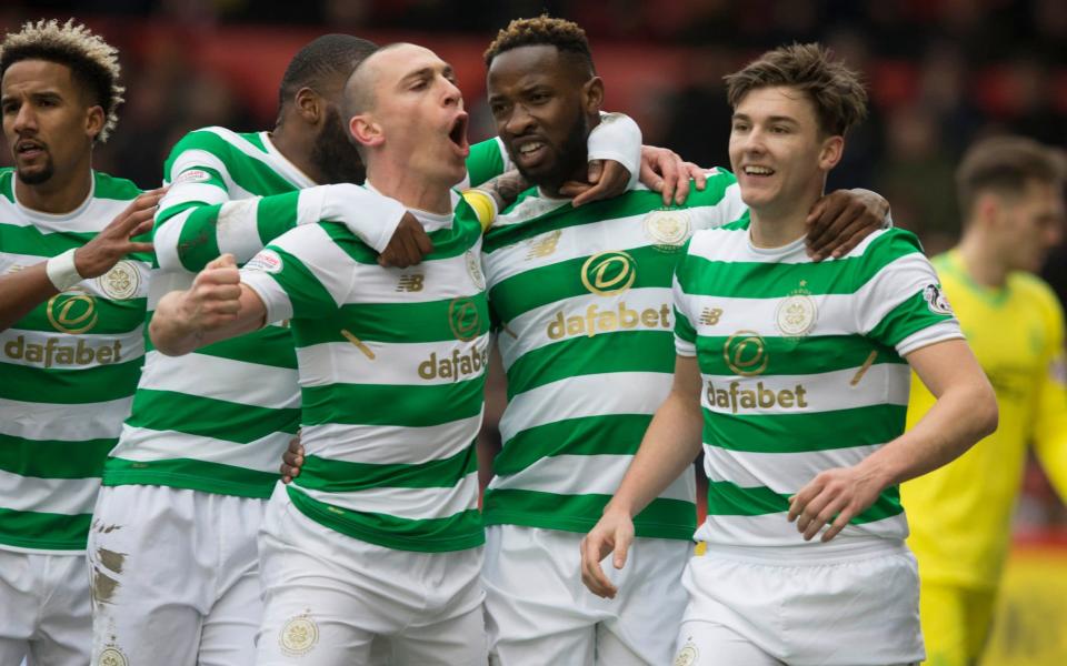 Celtic players celebrate Moussa Dembele's goal against Aberdeen - PA