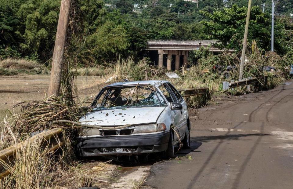 A wrecked car sits in the San Jose de Toa Baja neighborhood on Wednesday, Sept. 20, 2022 after it was flooded when the river Rio de la Plata overflowed as Hurricane Fiona hit Puerto Rico.