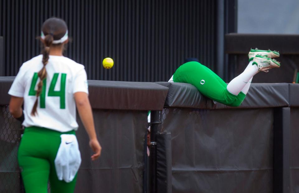 Oregon's Kai Luschar, right, dives for a foul ball during the second inning against Utah in their regular season game May 7.