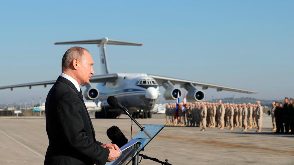 FILE - Russian President Vladimir Putin addresses the troops at the Hemeimeem air base in Syria, on Dec. 12, 2017. The Russian military intervention in Syria allowed Syrian President Bashar Assad's government to reclaim control over most of the country and helped expand Moscow's clout in the Middle East. (Mikhail Klimentyev, Sputnik, Kremlin Pool Photo via AP, File)