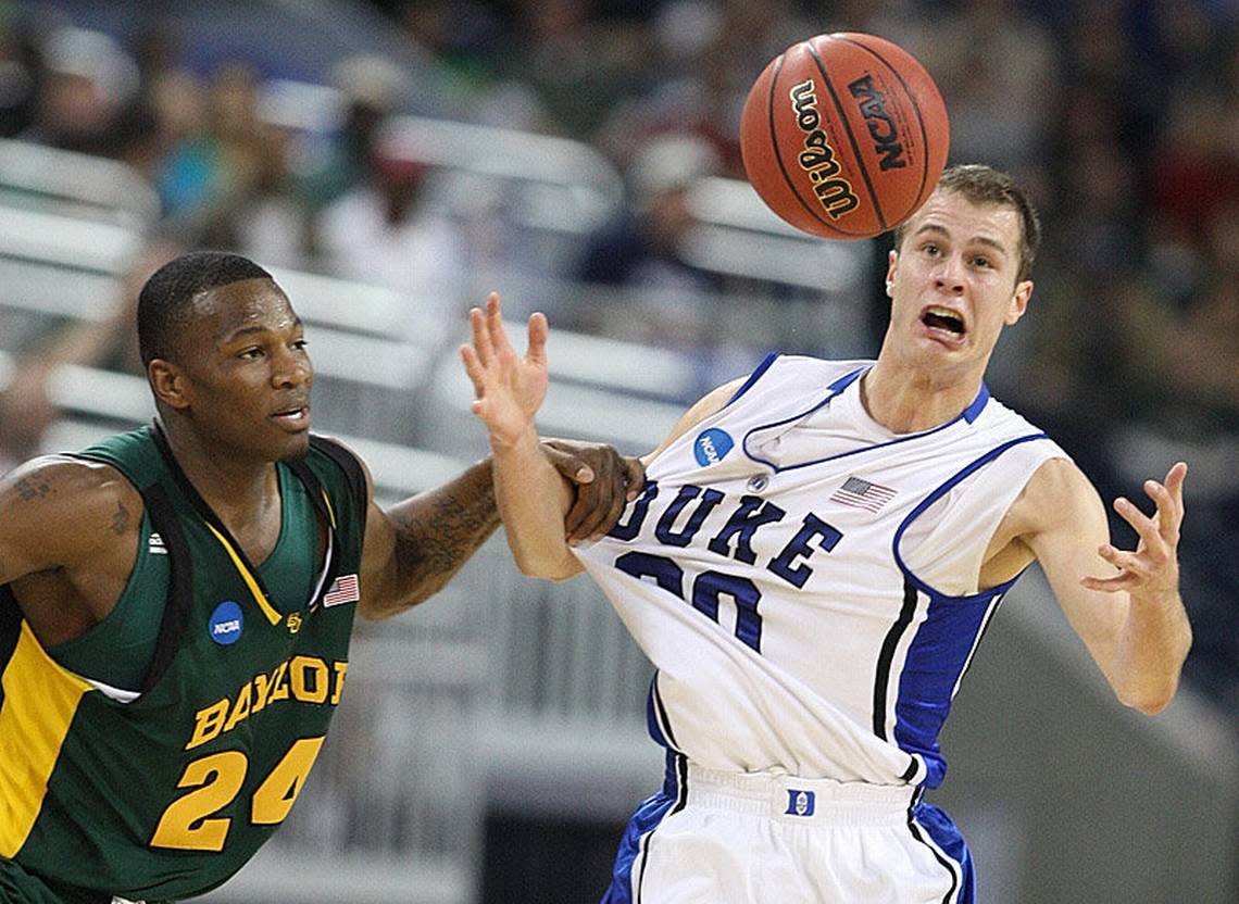 Baylor’s LaceDarius Dunn (24) knocks Duke’s Jon Scheyer (30) away from a loose ball in the first half of play in Houston, Tx. on Sunday, March 28, 2010.