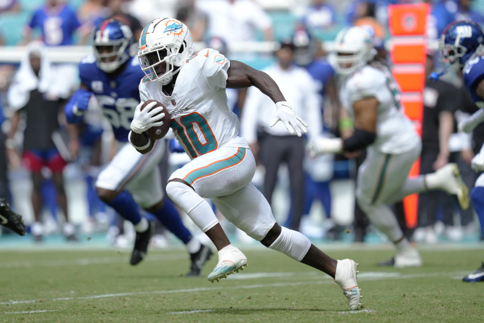Miami Dolphins wide receiver Tyreek Hill (10) runs a play during the first half of an NFL football game against the New York Giants, Sunday, Oct. 8, 2023, in Miami Gardens, Fla. (AP Photo/Rebecca Blackwell)