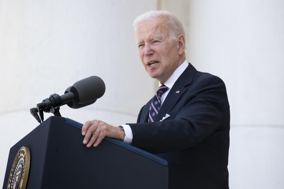 President Biden speaks at a lectern.