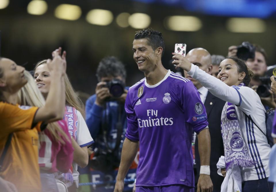 <p>Real Madrid’s Cristiano Ronaldo smiles at the end of the Champions League final soccer match between Juventus and Real Madrid at the Millennium Stadium in Cardiff, Wales </p>