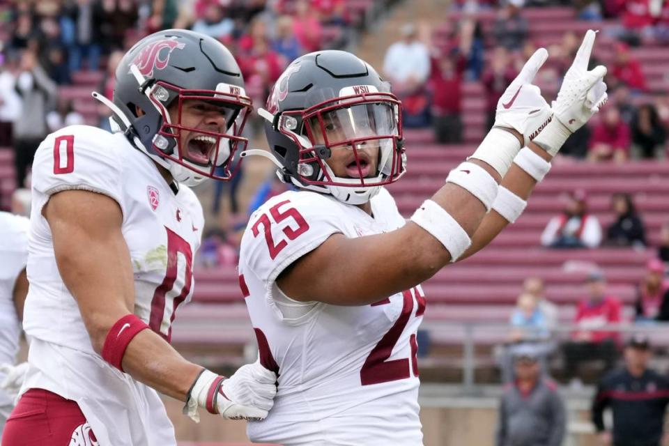 Washington State Cougars defensive back Jaden Hicks (25) celebrates with defensive back Sam Lockett III (0) after scoring a touchdown against the Stanford Cardinal during the second quarter at Stanford Stadium on Nov. 5, 2022.
