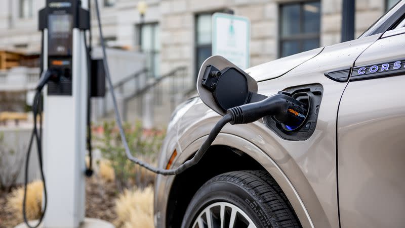 An electric vehicle charges at a charging station at the Capitol in Salt Lake City on Tuesday, March 29, 2022.