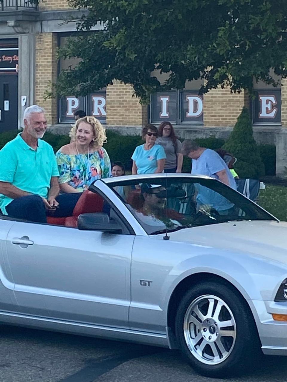 John Denny, Cy Young Award winner, and his wife are pictured riding in the Dean Chance Memorial Parade on Saturday afternoon. Denny was Grand Marshal for the event.