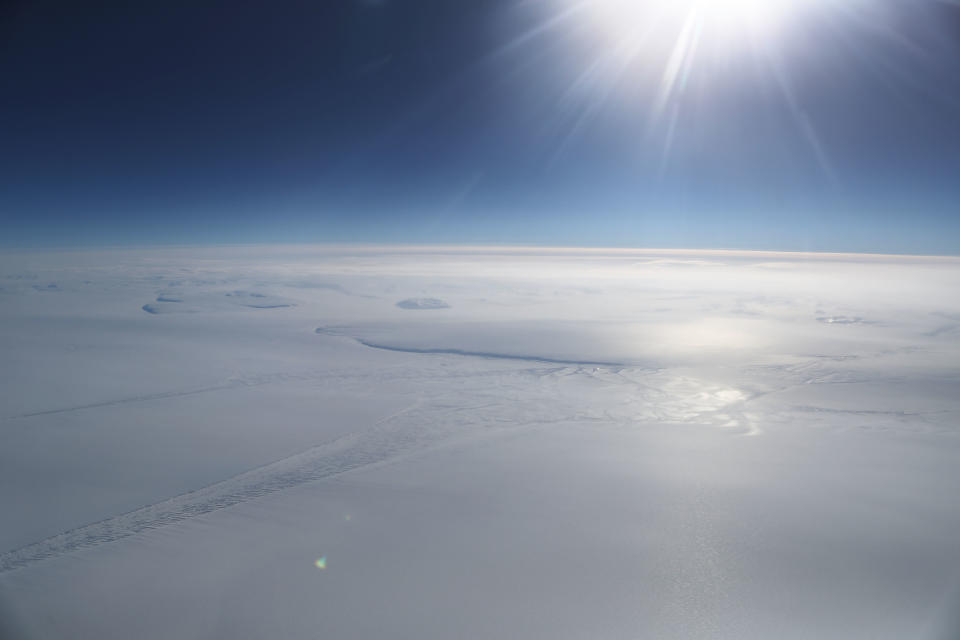 <p>Ice is seen from NASA’s Operation IceBridge research aircraft in the Antarctic Peninsula region, on Nov. 4, 2017, above Antarctica. (Photo: Mario Tama/Getty Images) </p>