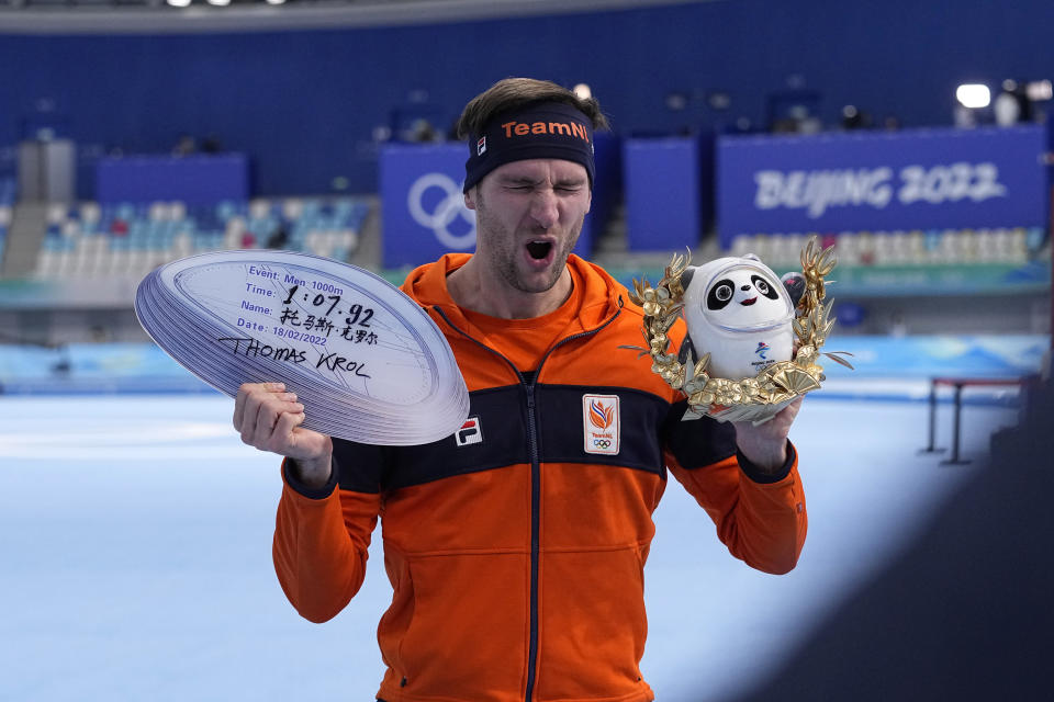 Gold medalist Thomas Krol of the Netherlands reacts during a venue ceremony for the men's speedskating 1,000-meter finals at the 2022 Winter Olympics, Friday, Feb. 18, 2022, in Beijing. (AP Photo/Sue Ogrocki)