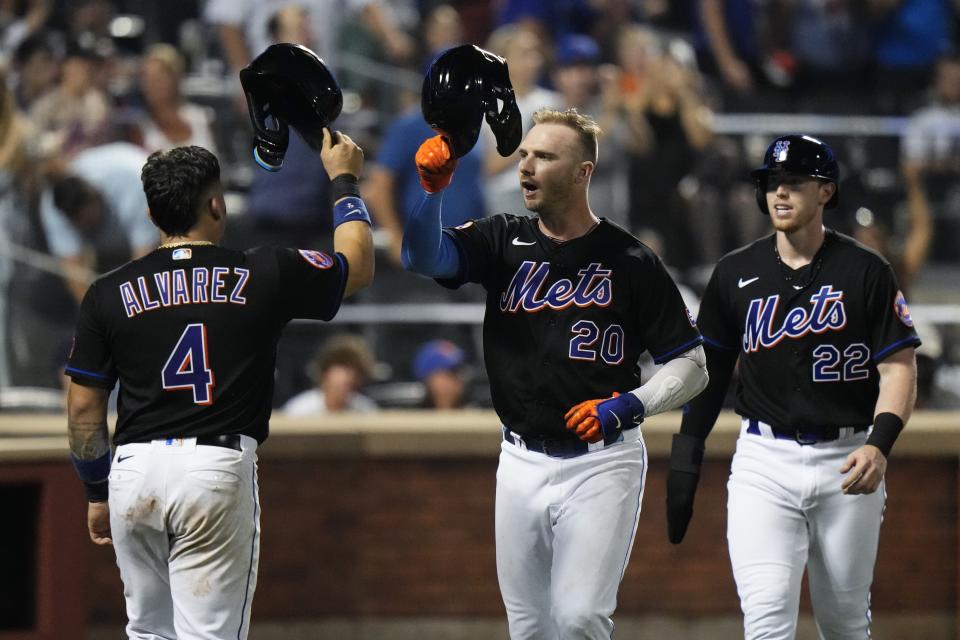 New York Mets' Pete Alonso (20) celebrates with Francisco Alvarez (4) and Brett Baty (22) after Alonso hit a three-run home run against the Washington Nationals during the fifth inning of a baseball game Friday, July 28, 2023, in New York. (AP Photo/Frank Franklin II)