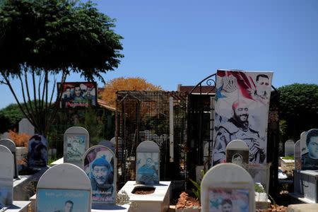 REFILE - CORRECTING TYPO IN DISTRICT'S NAME - A view of graves at a cemetery in the district of Zahraa in Homs city, Syria July 29, 2017. Picture taken July 29, 2017. REUTERS/Omar Sanadiki