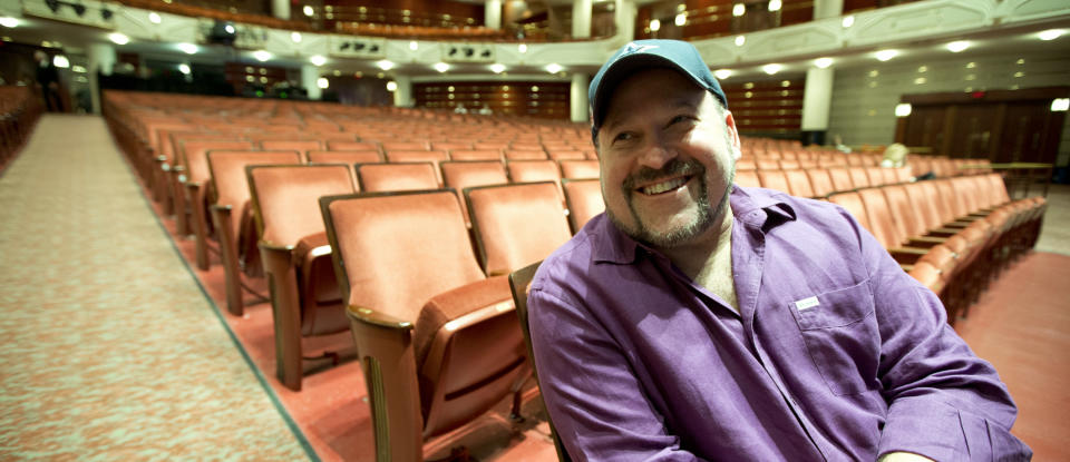 In this March 29, 2013 photo, composer Frank Wildhorn sits inside a theater in West Palm Beach, Fla. Wildhorn first found success as a pop and R&B songwriter, penning Whitney Houston's ballad "Where Do Broken Hearts Go.” He ruled Broadway in the late 1990s when he had three shows running simultaneously, a nearly four-year run for "Jekyll and Hyde," "The Scarlett Pimpernel" and "The Civil War," which all were nominated for Tony Awards. Now, Wildhorn's eighth Broadway show, a revamped revival of "Jekyll and Hyde," opens on April 18. (AP Photo/J Pat Carter)