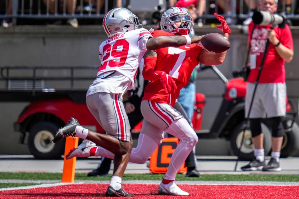 Apr 15, 2023; Columbus, Ohio, United States;  Ohio State Buckeyes cornerback Ryan Turner (29)  knocks the ball away from Ohio State Buckeyes wide receiver Kyion Grayes (7) during the third quarter of the Ohio State Buckeyes spring game at Ohio Stadium on Saturday morning. Mandatory Credit: Joseph Scheller-The Columbus Dispatch
