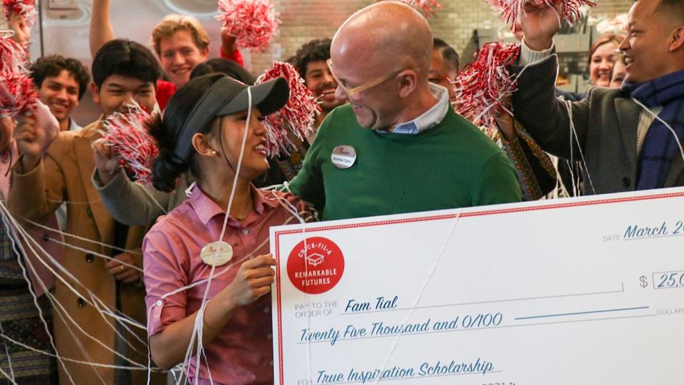 Chick-fil-A CEO Andrew Cathy, right, personally presented WT graduate student Fam Tial with a $25,000 True Inspiration Scholarship on March 1, one of 14 awarded in North America. Tial graduated in December from West Texas A&M University and has entered the WT Graduate School.