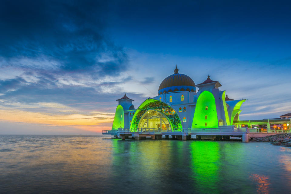 The Malacca Straits Mosque is located on a man-made island in Malaysia. This gorgeous mosque is also called the "<a href="https://melakatravel.info/what-to-do/malacca-straits-mosque-floating-mosque-melaka/" target="_blank">Floating Mosque</a>" for an illusion it gives off of sitting right&nbsp;on top of the water.