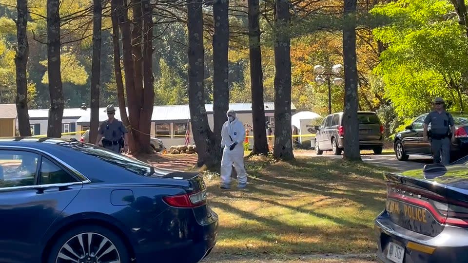 New York State Police and crime scene investigators walk across the property where Charlotte Sena was found.  - Maysoon Kahn/AP