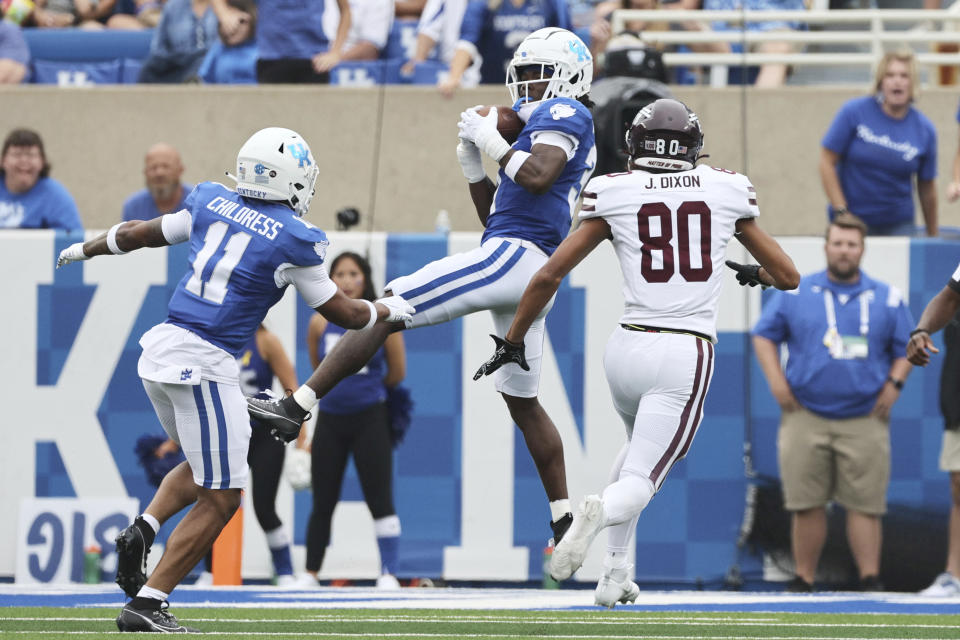 Kentucky defensive back Maxwell Hairston (31) grabs an interception over Eastern Kentucky wide receiver Jakob Dixon (80) in the end zone during the first half of an NCAA college football game in Lexington, Ky., Saturday, Sept. 9, 2023. (AP Photo/Michelle Haas Hutchins)