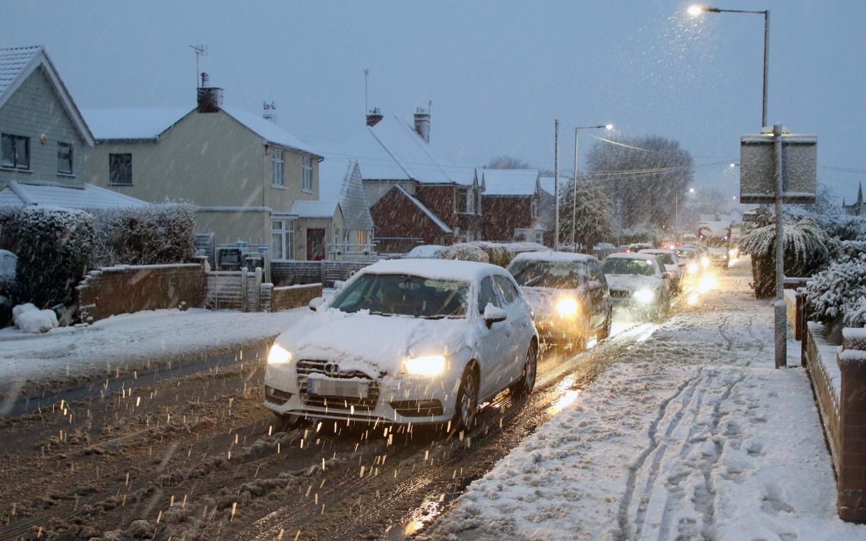 Motorists battling through the Snow in Colchester, Essex on Friday morning.  - EAST NEWS PRESS AGENCY 