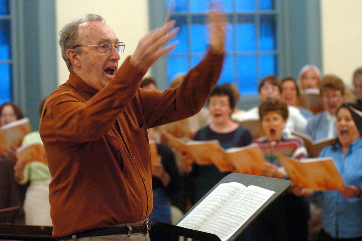 Gerald Mack leads the Worcester Chorus in rehearsal for his final concert in 2005.