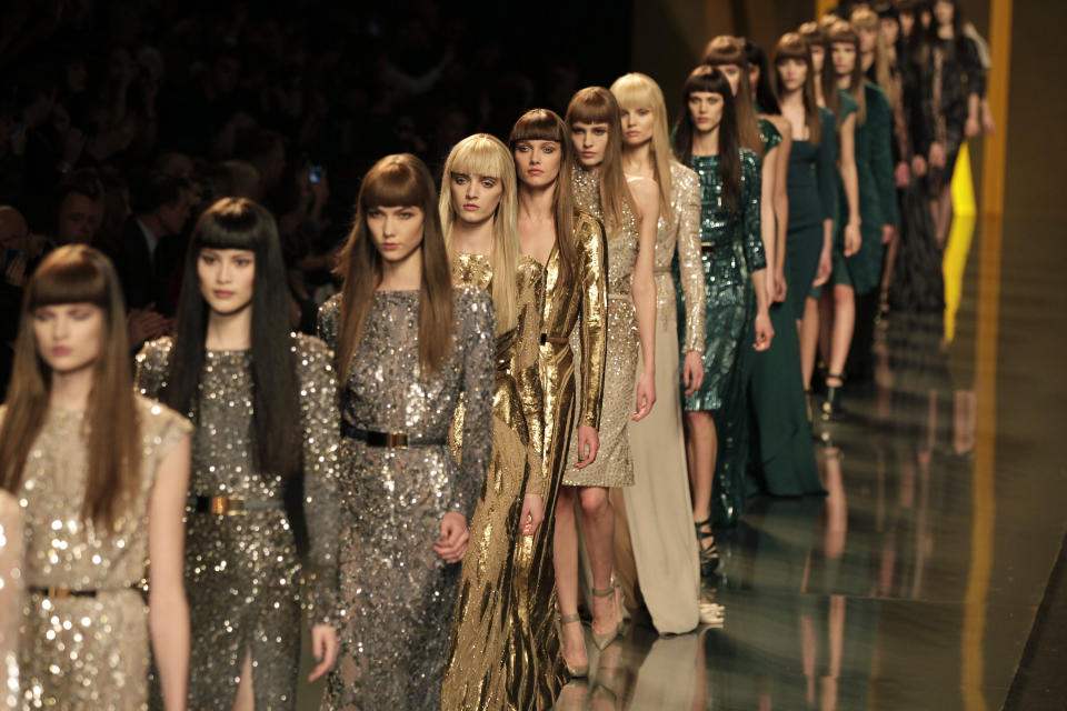 Models present creations b Lebanese designer Elie Saab as part of his Women's Fall-Winter, ready-to-wear 2013 fashion collection, during the Paris Fashion week, Wednesday, March 7, 2012. (AP Photo/Michel Euler)