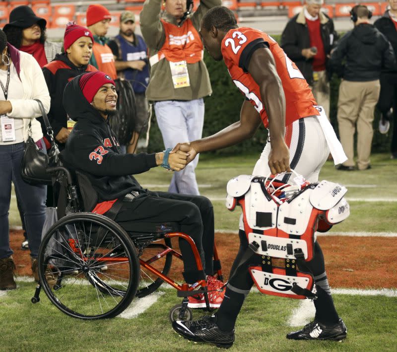 Devon Gales (L) was paralyzed in September 2015. (AP)