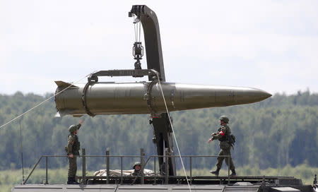 FILE PHOTO: Russian servicemen equip an Iskander tactical missile system at the Army-2015 international military-technical forum in Kubinka, outside Moscow, Russia, June 17, 2015. REUTERS/Sergei Karpukhin/File Photo