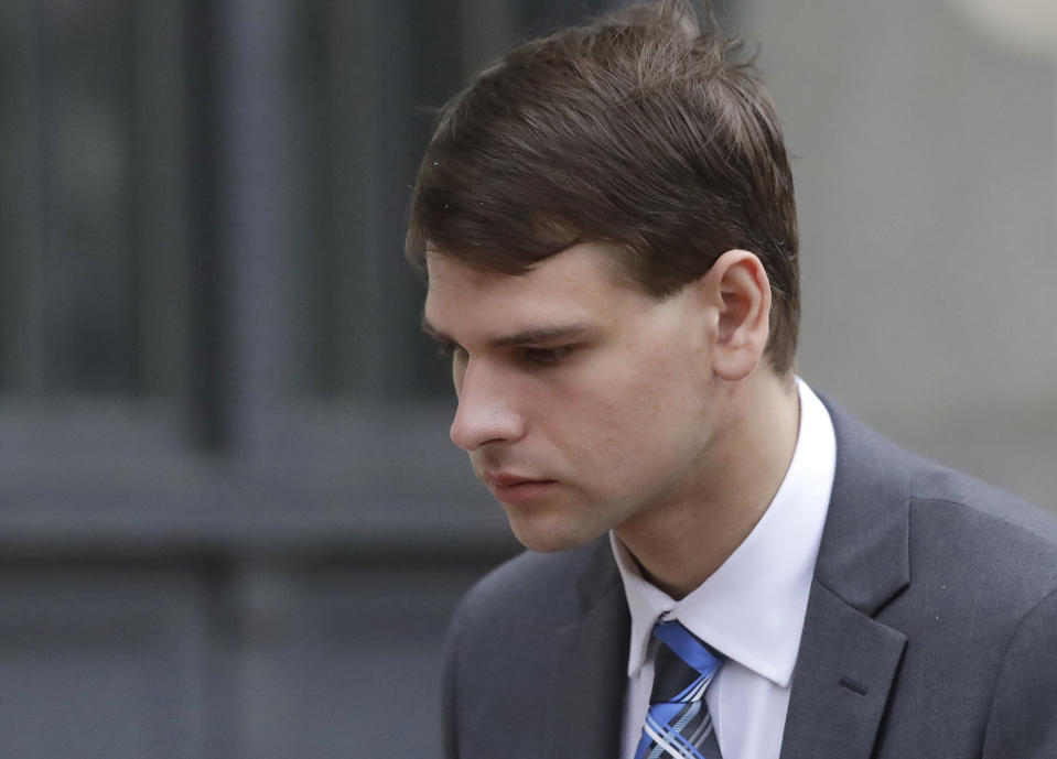 FILE - Nathan Carman departs federal court, Wednesday, Aug. 21, 2019, in Providence, R.I. Carman, found floating on a raft in the ocean off the coast of Rhode Island in 2016 after his boat sank has been indicted on charges alleging he killed his mother at sea to inherit the family's estate, according to the indictment unsealed Tuesday, May 10, 2022. (AP Photo/Steven Senne, File)