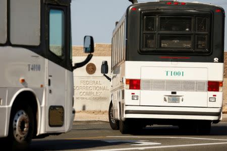 FILE PHOTO: Immigration and Customs Enforcement (ICE) detainees arrive at FCI Victorville federal prison in Victorville, California, U.S. June 8, 2018. REUTERS/Patrick T. Fallon/File Photo