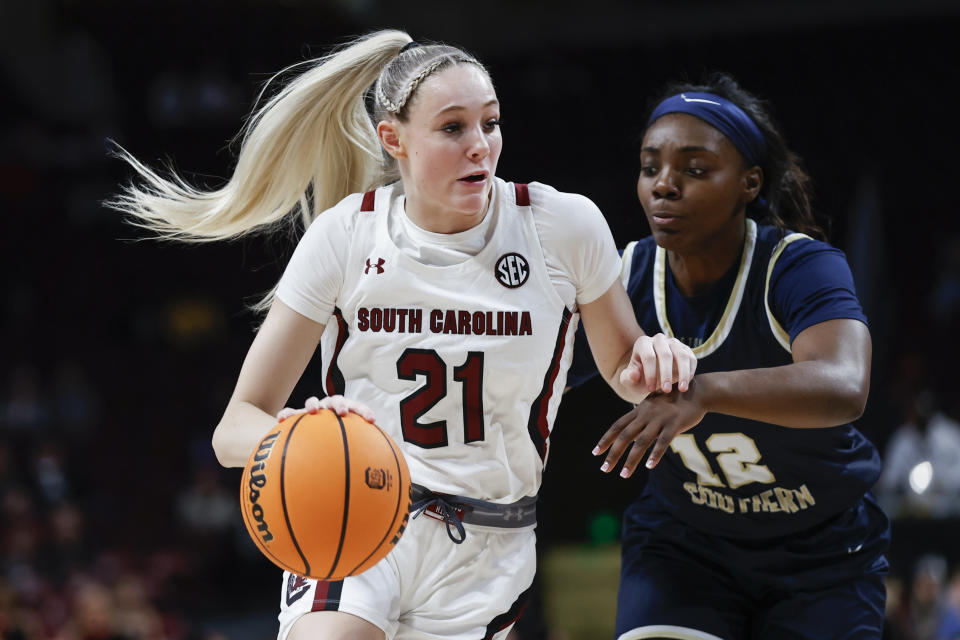 South Carolina forward Chloe Kitts takes on Charleston Southern Guard Zaire Hicks on December 18, 2022 in Columbia, SC. South Carolina won his 87-23 victory.  (AP Photo/Nell Redmond)