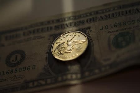 Greenback loses ground vs. loonie after mixed U.S. data