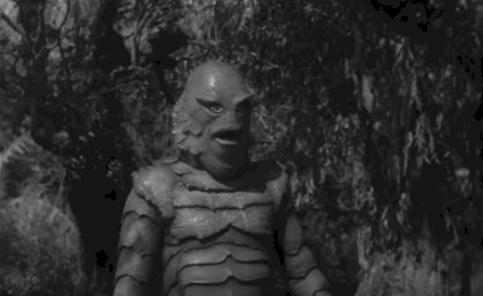 Gill-man walks towards the screen