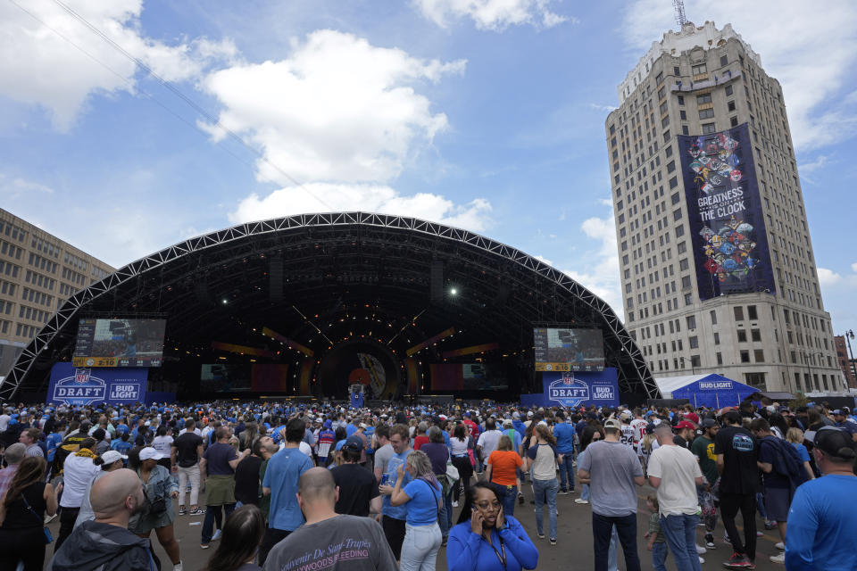 Fans watch the draft stage during the third day of the NFL football draft, Saturday, April 27, 2024, in Detroit. (AP Photo/Paul Sancya)