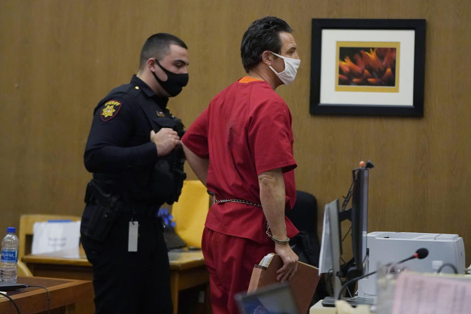 Scott Peterson, right, walks out of court after a hearing at San Mateo County Superior Court in Redwood City, Calif., Monday, Feb. 28, 2022. (AP Photo/Jeff Chiu, Pool)