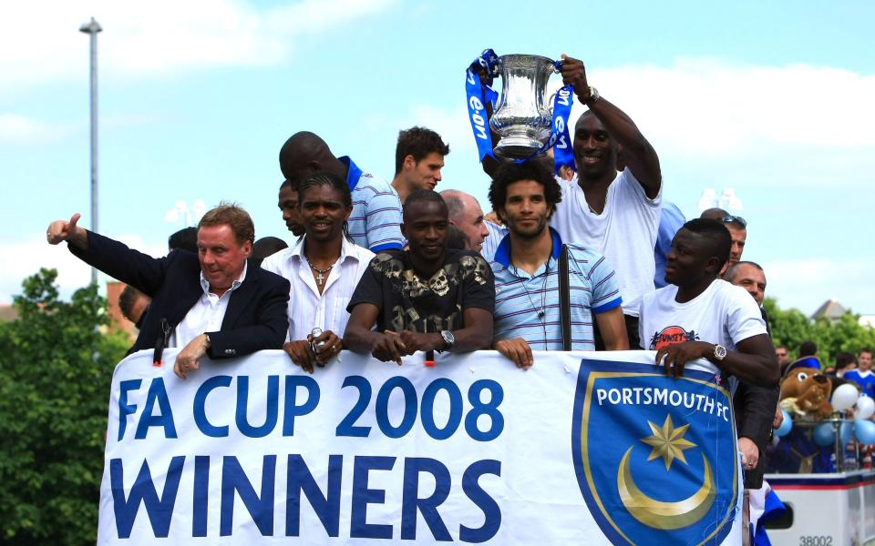 Harry Redknapp, Kanu, David James and Sol Campbell and the rest of the Portmouths team aboard the Portsmouth team bus as it makes its way through the crowds during the Portsmouth FA Cup Final Parade at Portsmouth on May 18, 2008 in Portsmouth, England - Getty Images/Jamie McDonald