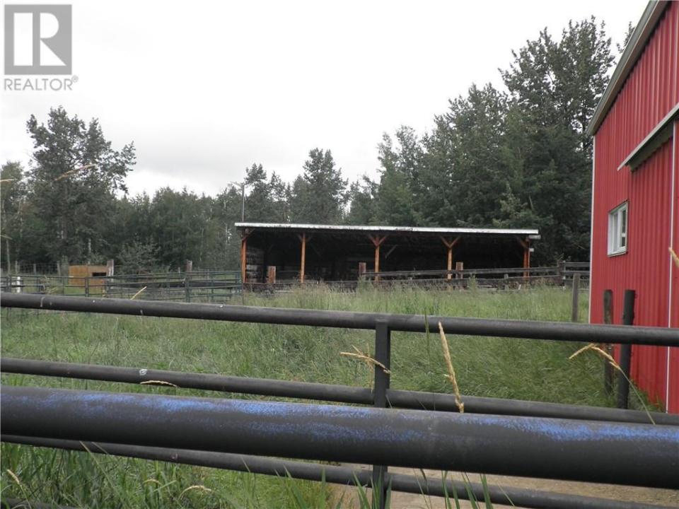 <p>The home sits on a 66-acre lot with a barn, workshop (both heated), garage, cattle shed and corrals. </p>