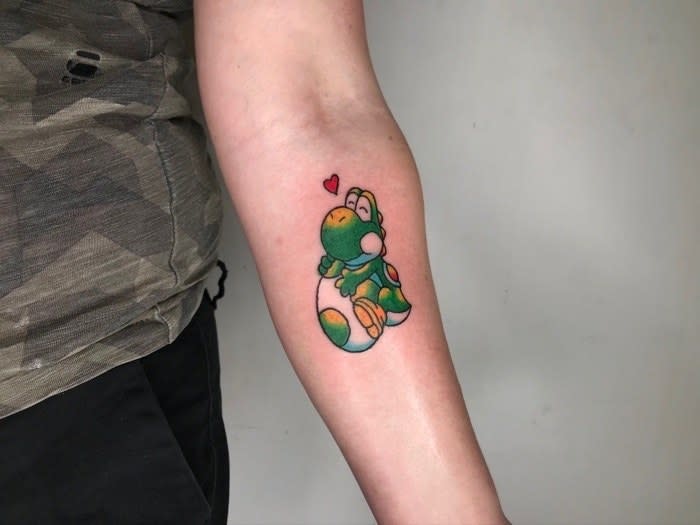 <div><p>"I have a tattoo of Yoshi, just because!"</p><p> —<a href="https://www.buzzfeed.com/lmhughes89" rel="nofollow noopener" target="_blank" data-ylk="slk:lmhughes89;elm:context_link;itc:0;sec:content-canvas" class="link ">lmhughes89</a></p></div><span><a href="https://www.buzzfeed.com/lmhughes89" rel="nofollow noopener" target="_blank" data-ylk="slk:buzzfeed.com;elm:context_link;itc:0;sec:content-canvas" class="link ">buzzfeed.com</a></span>