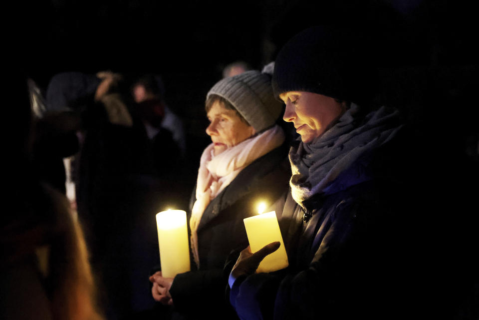 People participate in a candlelight pilgrimage walk which makes its way past an ancient well associated with St Brigid to the Solas Bhride Centre in Kildare, Ireland, Tuesday, Jan. 31, 2023. (AP Photo/Peter Morrison)