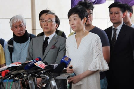 Pro-democracy legislator Tanya Chan speaks to the media about her health condition before entering the court in Hong Kong