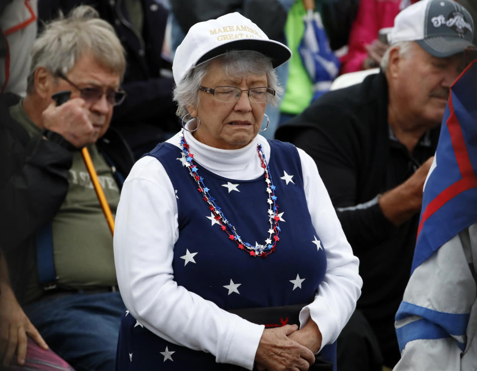 Visitors listen to remarks by President Donald Trump during the September 11th Flight 93 Memorial Service in Shanksville, Pa., Tuesday, Sept. 11, 2018. Trump is marking 17 years since the worst terrorist attack on U.S. soil by visiting the Pennsylvania field that became a Sept. 11 memorial. (AP Photo/Gene J. Puskar)