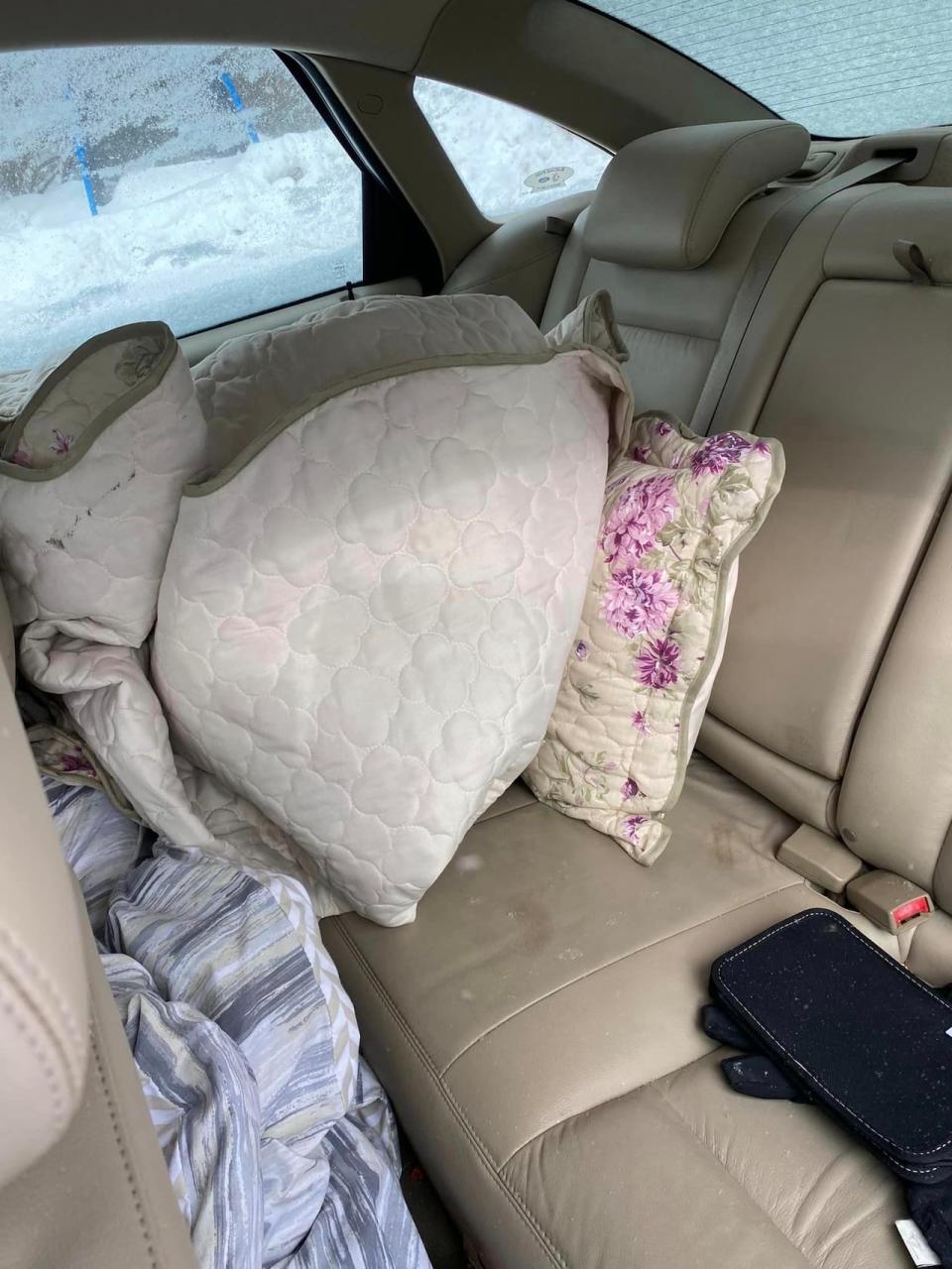 Pillows and blankets were left behind by the person who stole Dave Wilson's car.