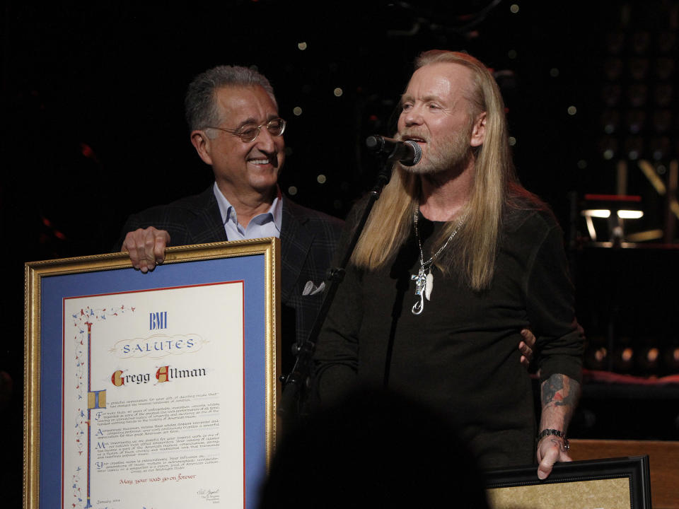 Gregg Allman received an award from Del Bryant, President of BMI during the show at All My Friends: Celebrating The Songs and Voice of Gregg Allman on Friday, Jan. 10, 2014 in Atlanta, Ga. (Photo by Dan Harr/Invision/AP)